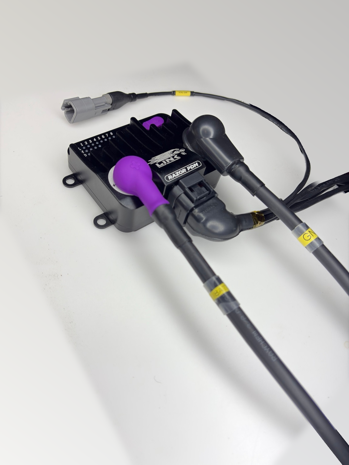 Custom VTI Link Razor PDM loom example in an angled view with labeled battery and ground leads