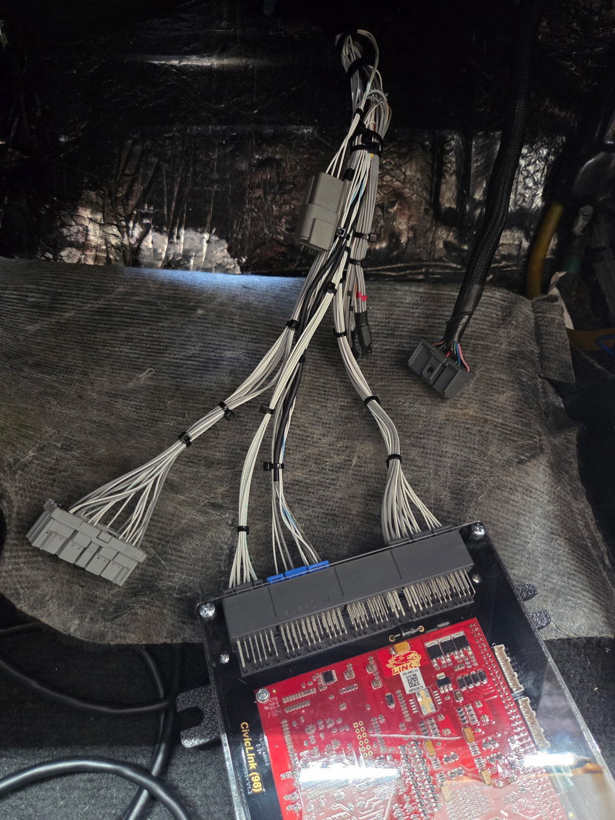 VTI Motorsports Honda OBD2A engine harness connected to an open Link ECU during assembly